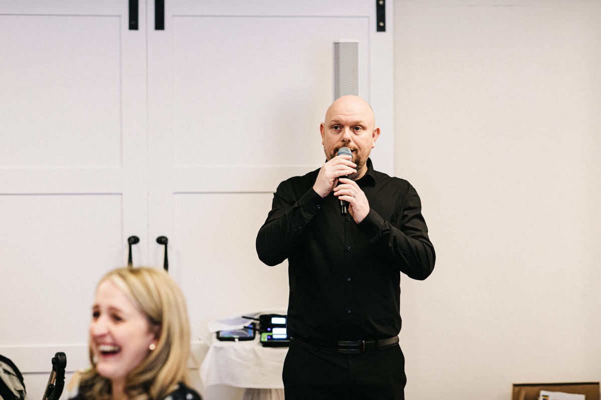 Maurice performing at an event for the Sing Along Waiters